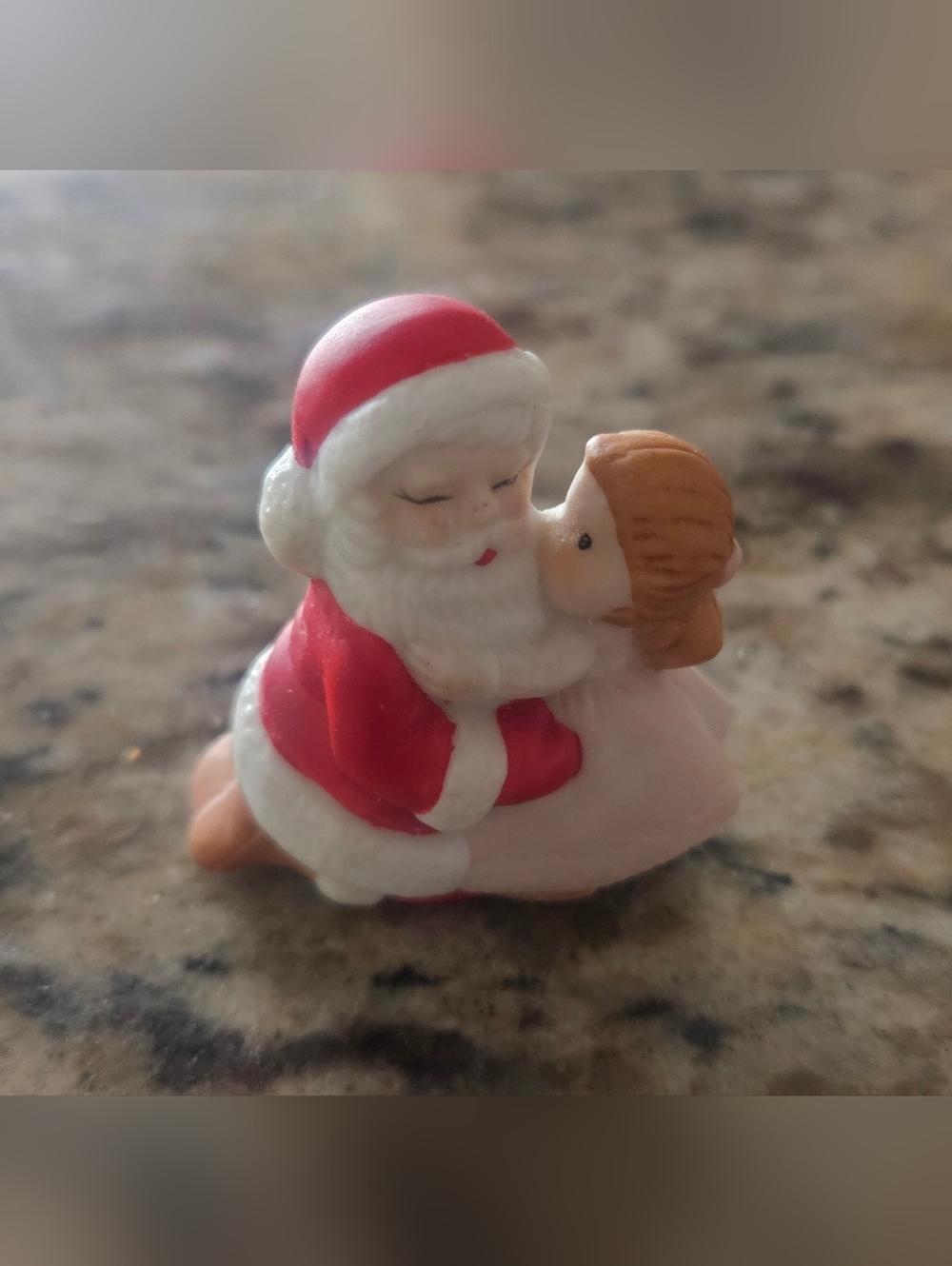 Festive Red and White Santa with Hugging Child